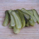 Маринованные огурчики так же нарезать очень тонко.